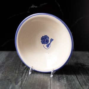 Blue flower pottery bowl marked Cruz 7"